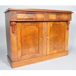 A Victorian mahogany chiffoniere with two frieze drawers above two panelled doors on plinth base,