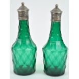 A pair of green glass facet cut cruet bottles, circa 1800, of usual form,
