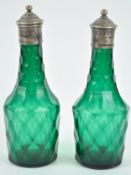 A pair of green glass facet cut cruet bottles, circa 1800, of usual form,