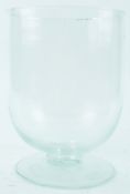 A late 19th century footed glass vase,