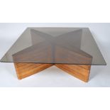A 20th century glass topped coffee table with engineered teak veneered base,