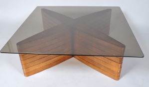 A 20th century glass topped coffee table with engineered teak veneered base,