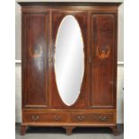 An Edwardian mahogany wardrobe by Waring & Gillows,