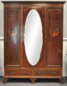 An Edwardian mahogany wardrobe by Waring & Gillows,