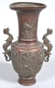 An early 20th century Japanese patinated brass two handled vase,