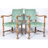 A pair of 19th century Continental style armchairs, each with green upholstered backs and seats,