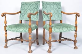 A pair of 19th century Continental style armchairs, each with green upholstered backs and seats,