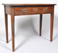 A George III oak side table with one frieze drawer, on square tapering legs, 73cm high x 87.