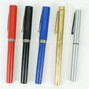 A gold plated Sheaffer White Dot fountain pen and four others