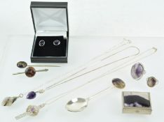 A collection of items to include: Two rings; A pair of stud earrings; Three pendants with chains;