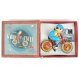 A boxed Triang tin plate and fabric gyro cycle toy,