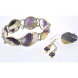 A collection of blue john jewellery to include: A seven domed panel bracelet;