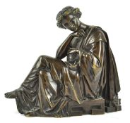 A 19th century bronze figure of a lady seated, wearing classical costume,