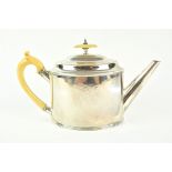 A George III silver tea pot, of plain oval bead edge form, with domed cover, Ivory knop and handle,