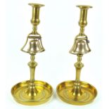 A pair of brass Tavern candlesticks, each mounted with a bell,