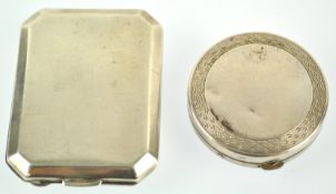 A silver matchbook case, of plain rectangular cut cornered form, with gilt interior,