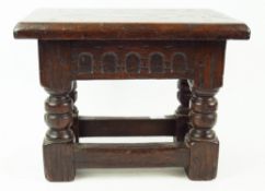 A 19th century rectangular oak stool, in the 16th century style,