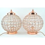 A pair of simulated copper and crystal globular ceiling lights,