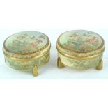 A pair of Japanese earthenware bowls and covers, each painted with flyibng birds and flowers,