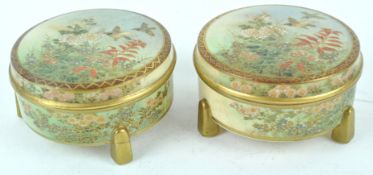 A pair of Japanese earthenware bowls and covers, each painted with flyibng birds and flowers,