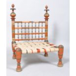 An Indian turned and painted marriage chair, 89cm high overall x 60.