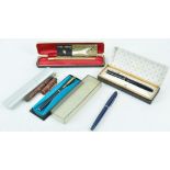 A Parker gilt finish 61 fountain pen and four others