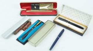 A Parker gilt finish 61 fountain pen and four others