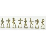 Eight brass Ashanti type weights, depicting musicians,