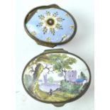 A 19th century enamel snuff box, the top with a castle scene, 5cm wide and another,