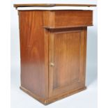 A Victorian mahogany cased pottery sink above one panelled door opening to reveal a shelf with a