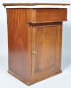 A Victorian mahogany cased pottery sink above one panelled door opening to reveal a shelf with a