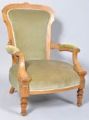 A Victorian walnut and box wood strung framed armchair with upholstered back and seat on turned