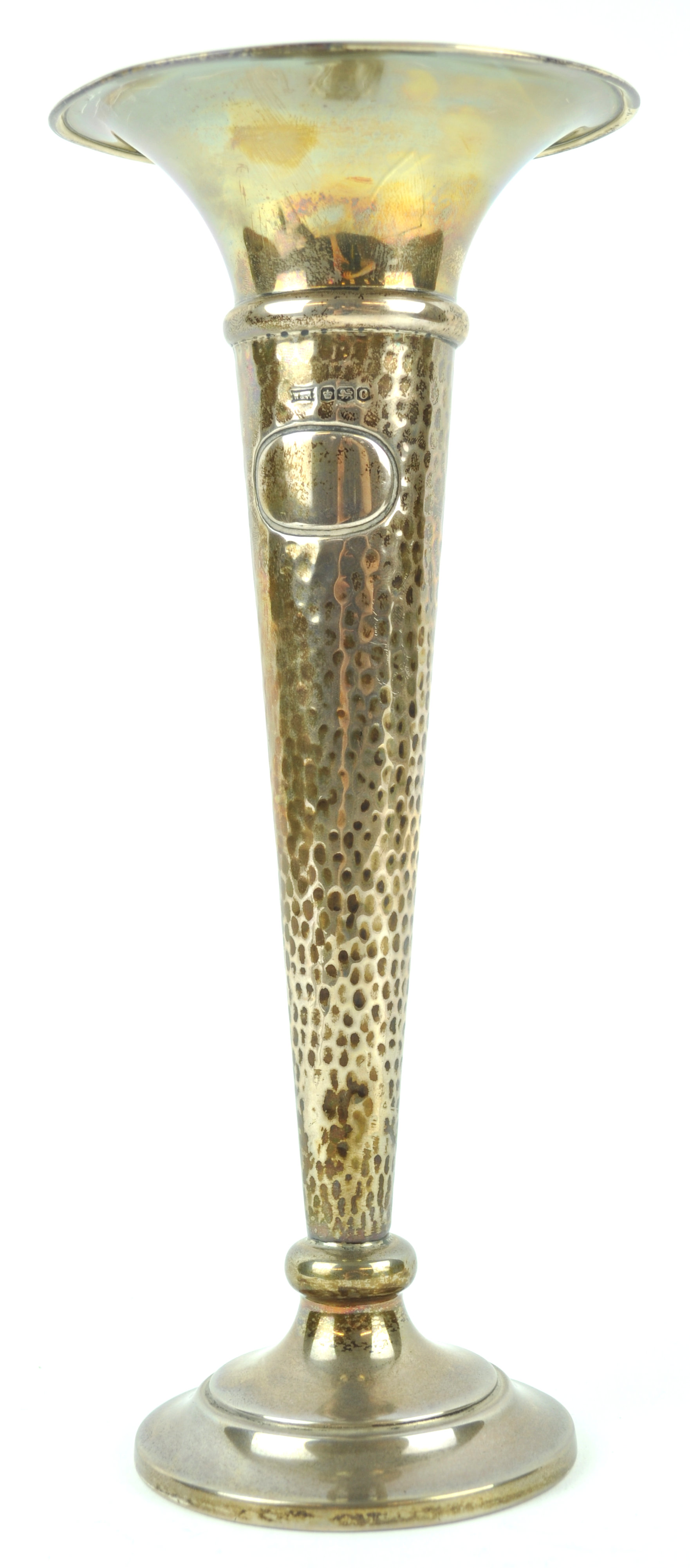 A silver trumpet vase with flared lip over a split hammered body, on a plain loaded foot,