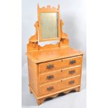 A Victorian pine dressing table with original paint work, the swing mirror above three long drawers,