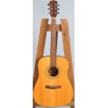 A Fender acoustic guitar, labelled DG-145 TF, 104cm long,