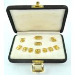 A suite of eleven rectangular faceted cut citrine quartz stones of variable sizes.