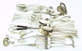 A group of assorted silver flatware in the old English, Hanoverian, Fiddle and other patterns,