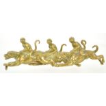 An early 20th century brass paperweight, modelled as three monkeys riding dogs, 12.