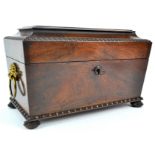 A William IV rosewood tea caddy, with gilt lion mask and ring handles, lacking interior, 20.