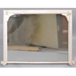 A Victorian rectangular over mantle mirror, later painted white,