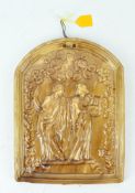 A 19th century treacle glazed arched rectangular plaque, moulded with two classical ladies,