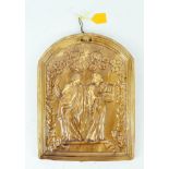 A 19th century treacle glazed arched rectangular plaque, moulded with two classical ladies,