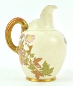 A Royal Worcester blush ivory jug, painted and gilded with flowers, factory marks in puce,
