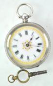An Edwardian white metal ladies pocket watch, the enamel with gilded decoration,