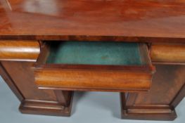 A Victorian mahogany pedestal sideboard with raised back above three frieze drawers and two