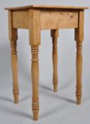 A small rectangular pine table, on turned legs, 72.5cm x 45.
