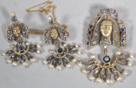 A yellow metal demi parure of two brooches.