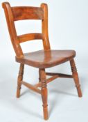 A 19th century country child's chair with double rail back,