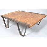 An Industrial iron mounted palette table with five plank top,