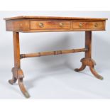 A 19th century mahogany sofa table with two frieze drawers and two faux drawers on rectangular